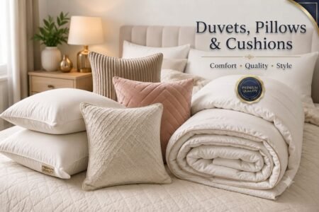 Premium duvets, pillows and cushions arranged on a luxury bed in a modern bedroom