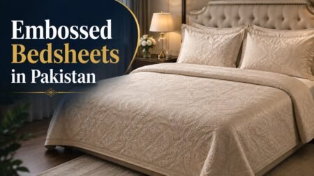Premium embossed bedsheets in Pakistan with elegant raised floral patterns on a luxurious cream bed in a modern bedroom.
